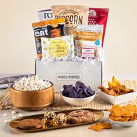 Thumbnail for Open gift box labeled ‘Gluten & Nut-Free Vegan Treats’ with dark chocolate, veggie chips, cookies, and dried mango.