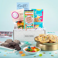 Thumbnail for Open gift basket labeled ‘Happy Birthday’ with birthday cake cookies, gummies, and chocolate birthday bar.