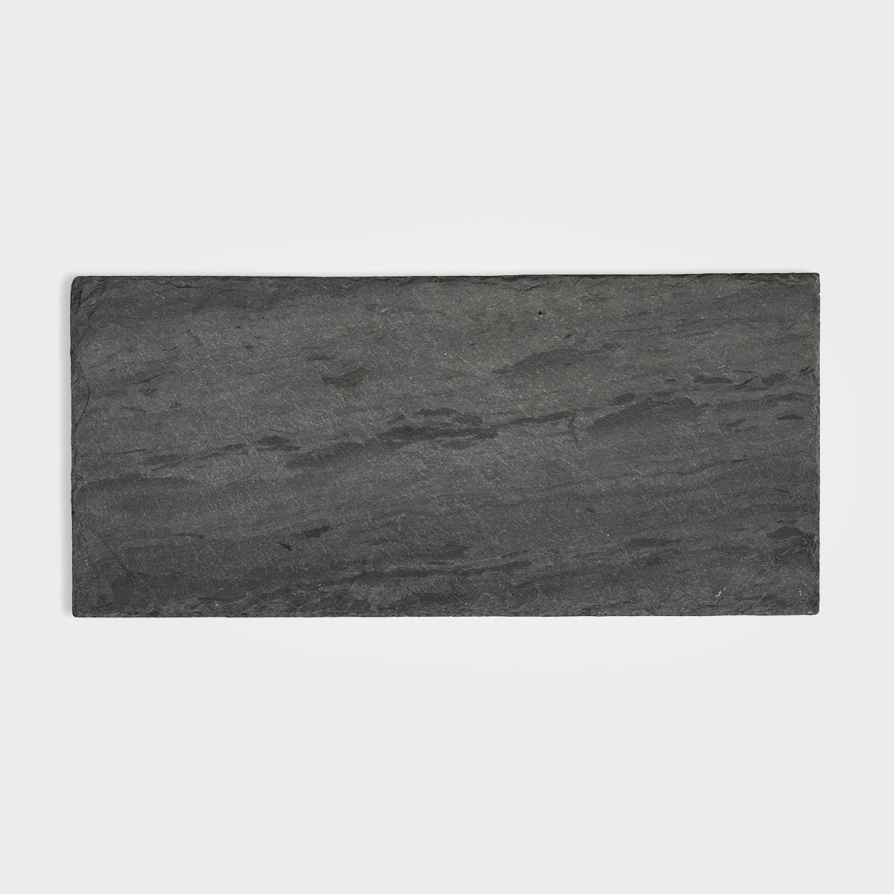 Rectangular black slate serving board with a natural stone texture, ideal for cheese, charcuterie, or gourmet presentations