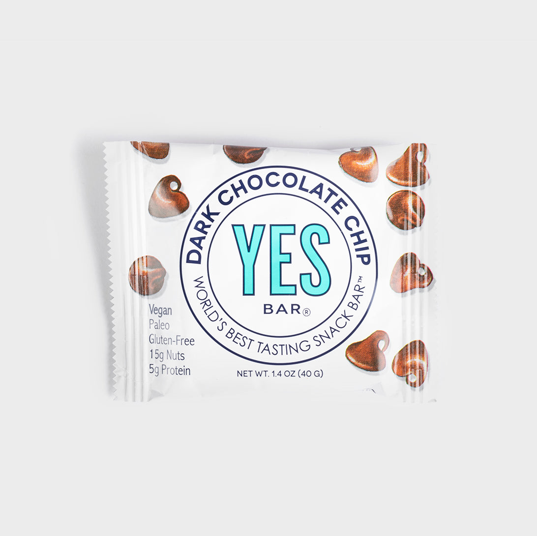 YES Bar Dark Chocolate Chip snack bar in white packaging with chocolate chip illustrations, vegan and gluten-free