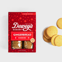 Thumbnail for Dewey’s Bakery limited edition gingerbread cookies in festive red packaging, with a stack of cookies displayed