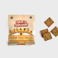 Thumbnail for Fair & Square plant-based cheddar crackers next to a few cracker pieces