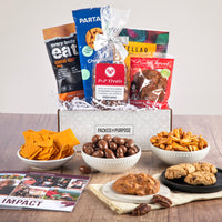 Thumbnail for Open gift basket labeled ‘Many Thanks’ with bite-sized cookies, praline, cheese balls, and chocolate truffle bar.