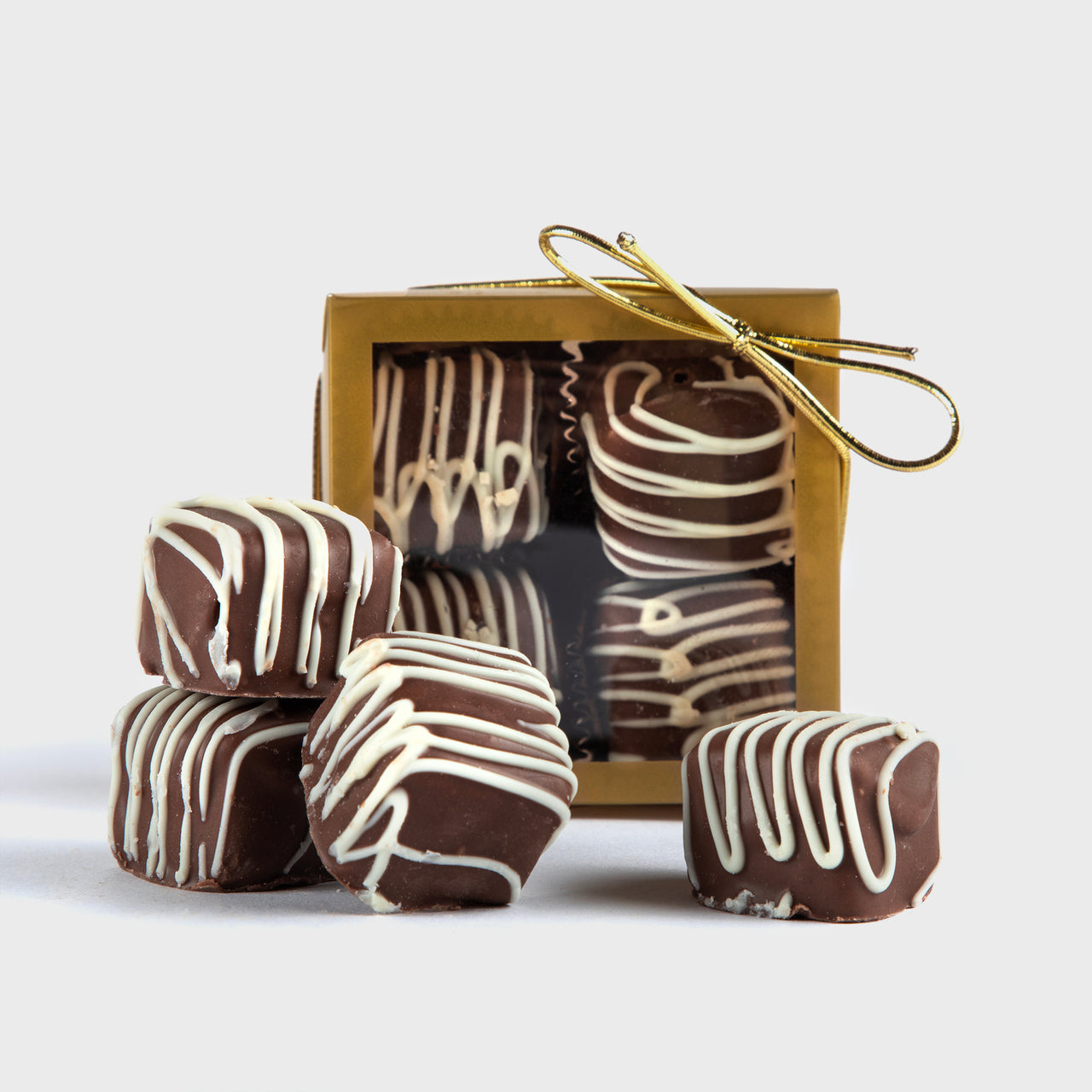 Milk chocolate meltaways with white drizzle, 4 pc. Ideal to elevate client gifting and employee appreciation