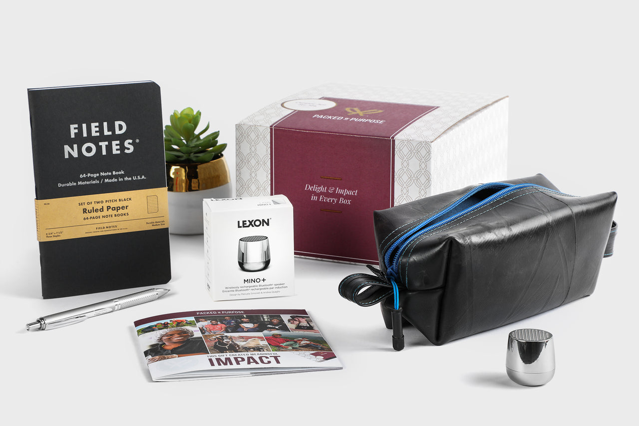 travel set made from recycled materials that includes a bag and bluetooth speaker