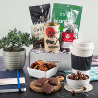 Thumbnail for Open gift basket labeled ‘Positive Vibes Deluxe’ with terrazzo mug, organic tea, chocolate meltaways, jam, toffee, a journal and bonsai grow kit.