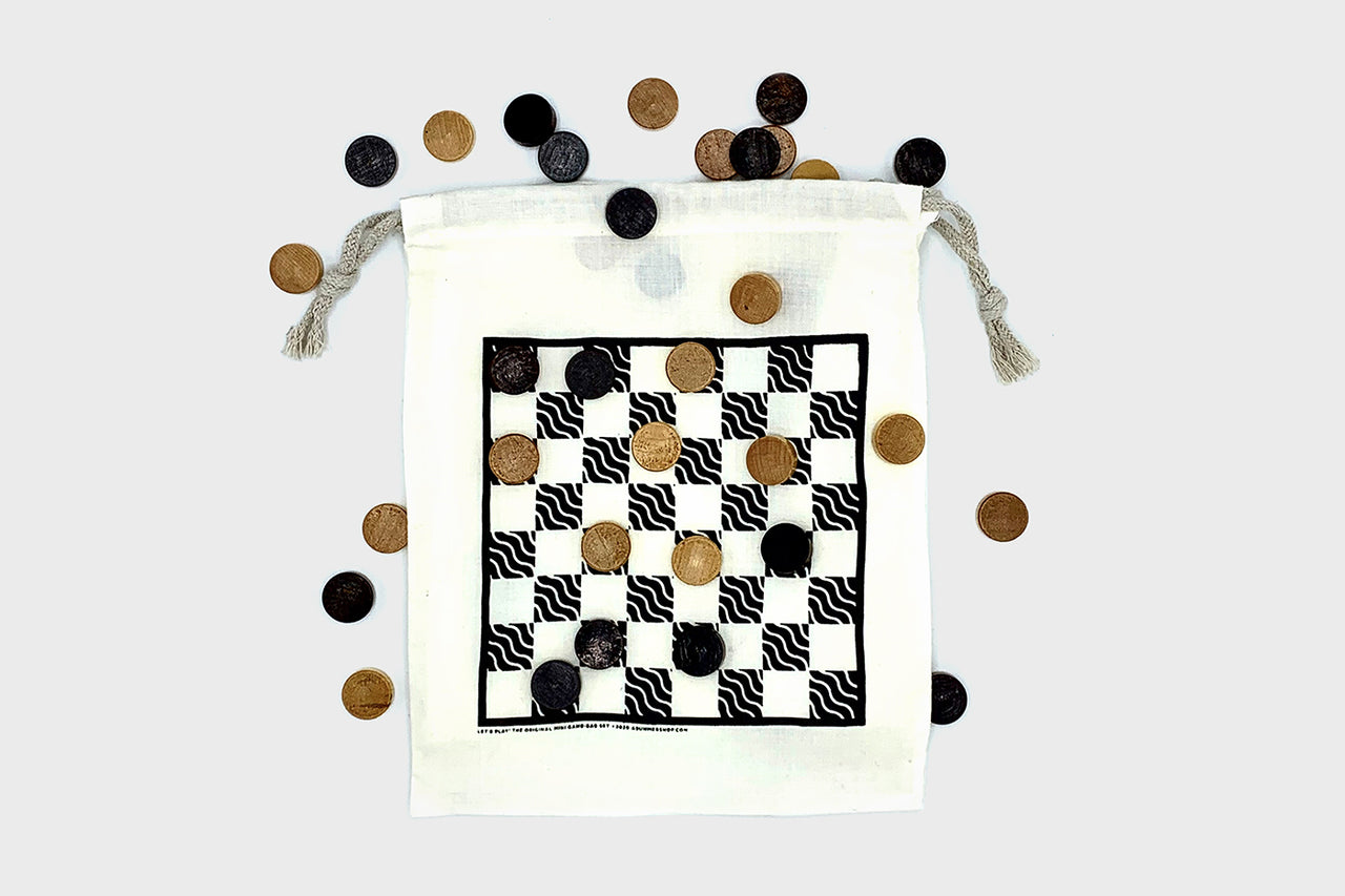Portable and reversible cotton game bag with 24 wooden game pieces